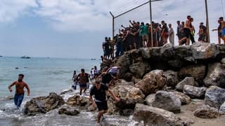 Spain rushes to Ceuta as 60,000 migrants flood across from Morocco