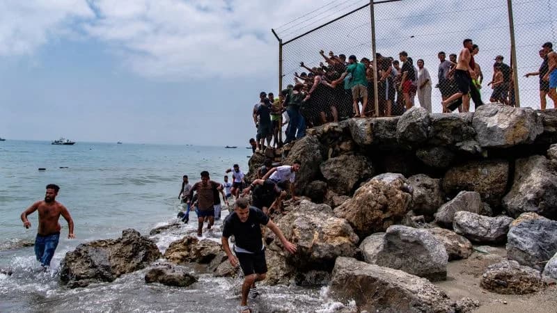 Spain rushes to Ceuta as 60,000 migrants flood across from Morocco