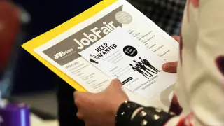 Jobless claims dip to 203,000 as hiring remains sluggish