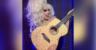 Dolly Parton’s rhinestone guitar becomes a glittering gift for a Texas drag queen