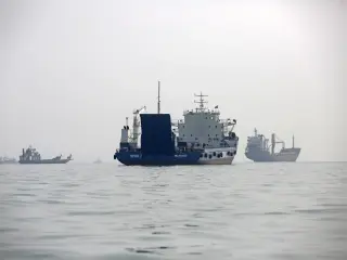 Iranian IRGC blames mines for twin tanker fires as Hormuz transit collapses