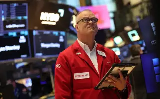 ASML lift cushions markets as memory-chip slide weighs on tech