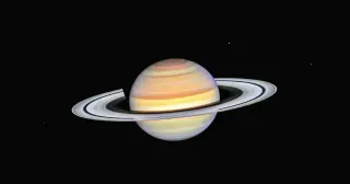Dinosaurs Saw a Ringless Saturn: Cassini Reveals Rings Are a Recent Arrival