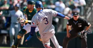 Rangers rally past A's in wild, wind-swept Sacramento win