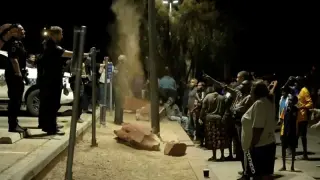 Outback mockery of justice: vigilante clashes erupt as alleged child killer is arrested in Alice Springs