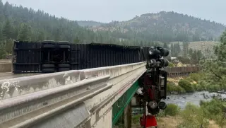 Semi truck teeters over bridge as I-80 eastbound closes near CA-NV line