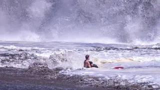 Lifeguard confronts colossal surf to save boy at Seabright Beach