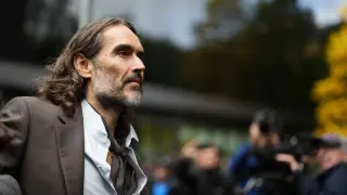 Brand Denies Rape Charges, Cites Media Impact as Wife Testifies in Support
