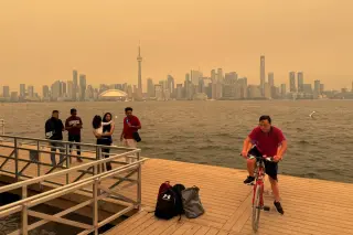 Climate-fueled wildfires are turning North American skies orange