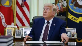 Trump signs order converting about 8,000 federal policy roles to at-will status