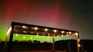 Auroras light up the night as a partial lunar eclipse dazzles tonight