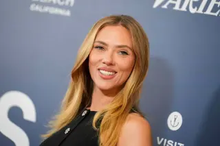 Scarlett Johansson Shines in Violet Swimsuit in Makeup-Free Sunbathing Clip