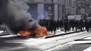 Macron's Madrid speech on speech limits clashes with France's escalating school riots