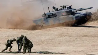 Japan lifts ban on lethal arms exports, courting global defence markets