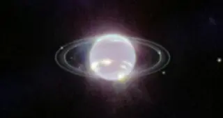 Webb Finds Ancient Hydrated Clay on Neptune’s Inner Moons, Hinting at a Lost Satellite System