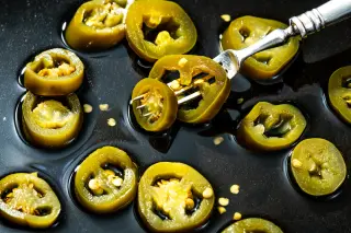 Jalapeño-linked salmonella outbreak prompts Chipotle and Qdoba to drop peppers across 27 states