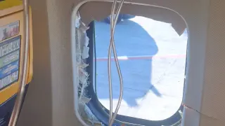 Ryanair window blowout: fellow passengers pull man back inside during emergency landing