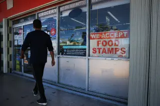 Poverty Rate Nudges Down, Yet Experts Warn of Harder Times Ahead
