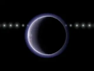Tiny 500-km world beyond Neptune may host a fleeting atmosphere
