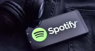 Spotify Beats Q1 but Guides Soft Q2, Sparking Share Slide
