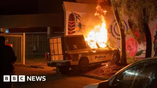 Alice Springs erupts as murder suspect is treated amid crowd outside hospital