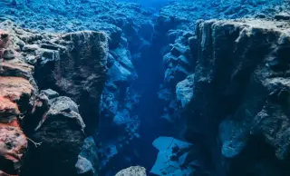 Hidden Ocean Brakes Limit Earthquakes on a Pacific Transform Fault