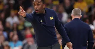 Michigan bets on Boynton's pedigree over Moore's in-house path