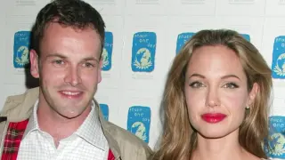 Jonny Lee Miller reveals rugged new look in rare photo with son