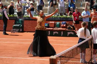 Osaka lights up Paris with a sequined gold dress at the French Open