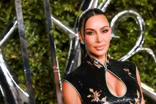 Kim Kardashian Stuns in Molten Brown Snakeskin Bra and Cutout Skirt