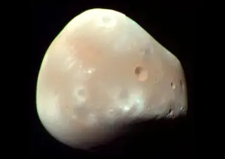 Deimos's Near-Surface Gravity Turns Orbit into Racewalking Pace