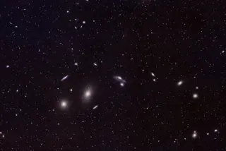 Massive Cosmic Filament Reveals Synchronized Galaxy Spins, Posing New Spin-Formation Questions