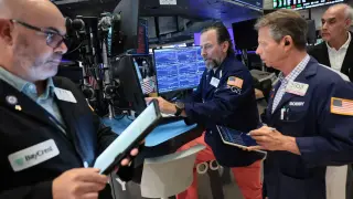 Markets slip as yields rise ahead of inflation data and AI earnings