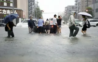 Nagoya drenched as torrential rain triggers highest flood warning and transit disruption