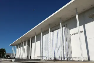 Kennedy Center facade stripped of Trump's name, now concealed by tarp
