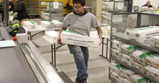 Judge blocks USPS mail-ballot rules over authority and disenfranchisement concerns
