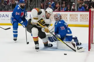 Bednar exits after puck strike as Avs fall in OT to Knights