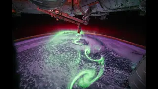 Space Station Captures Neon-Green Aurora Over Earth