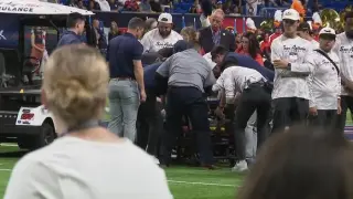 Alamodome pregame ceremony interrupted by military member's fall from ceiling