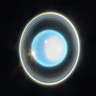 Contrasting Hues on Uranus’ Rings Suggest Distinct Origins