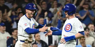 Cubs ride 7-game surge to 7-4 win, despite leaving 17 on base