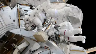 Historic all-female ISS spacewalk swaps camera and docking gear