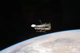 Hubble’s Slews Without Fuel: Wheels and Earth’s Field Do the Pointing