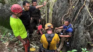 Laos cave rescue shifts to new shaft as potential knocks hint at life