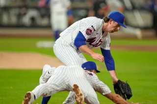 Mets' Jared Young sidelined by concussion symptoms after collision with Nolan McLean; CT scan negative