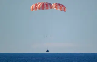 Underwater photos capture Artemis 2 splashdown heat shield in action