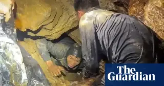 Five rescued, two missing as Laos cave rescue fights through dangerous passages