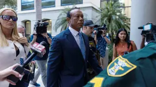 Woods pleads no contest to reduced reckless driving charge, five-year license suspension