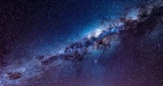 Behind the Milky Way’s Dust, the Great Attractor Emerges