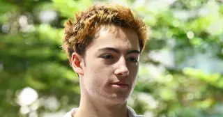 French teen charged in Singapore after licking vending-machine straw video